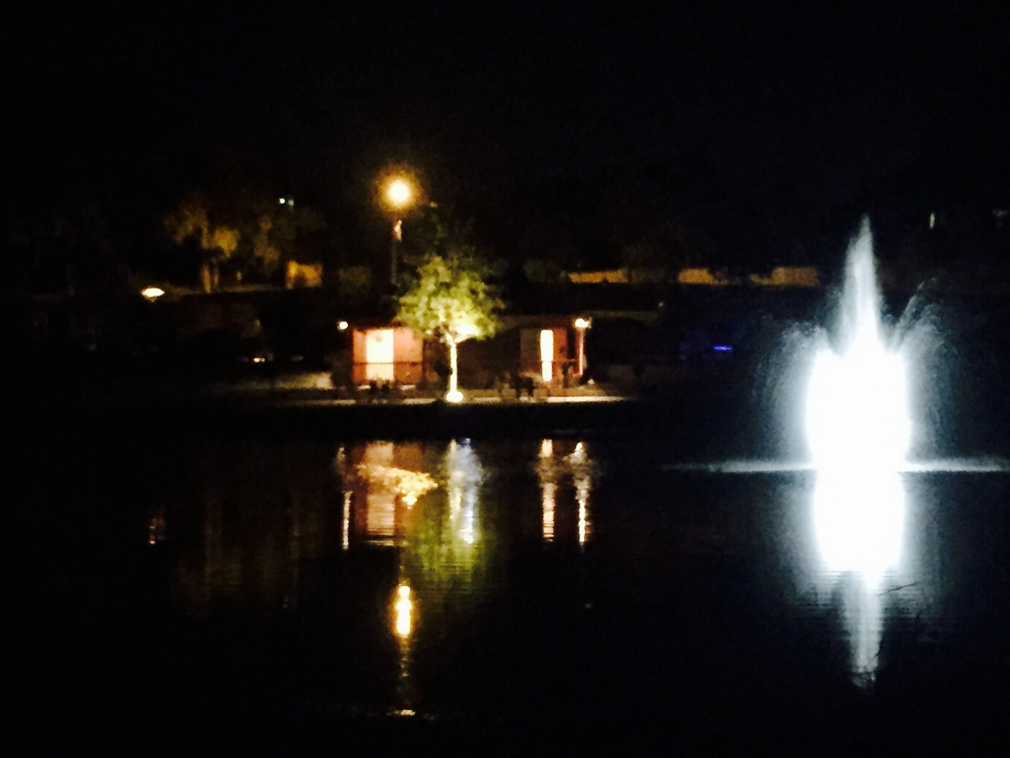 Patio at night with the fountain lit